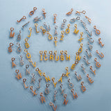 Klasiskie burta K Ketten-Charms